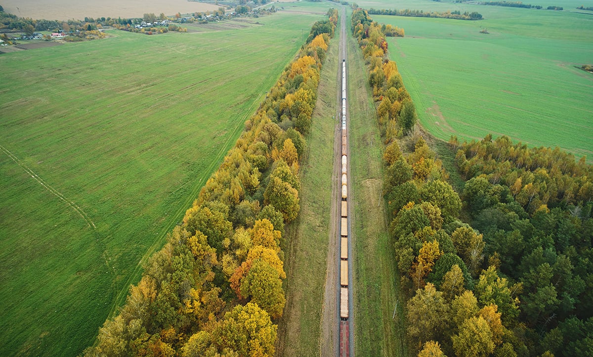 Long train moving to station